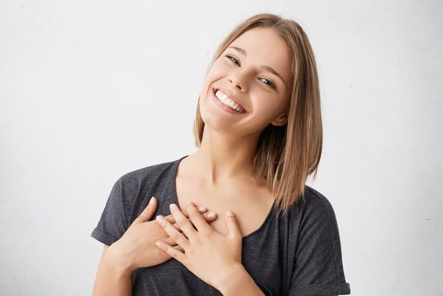 Smiling woman portraying perfection.