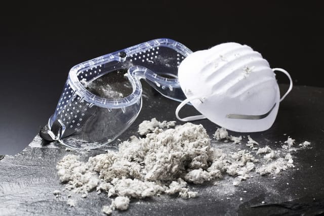 Asbestos with work goggles and a mask.