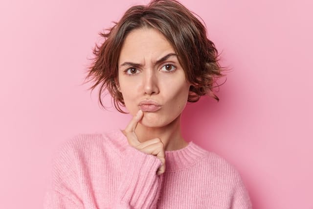 Woman with raised eyebrow.