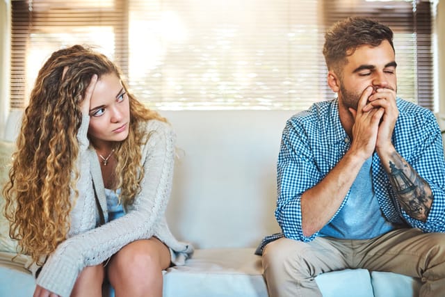 upset couple on couch