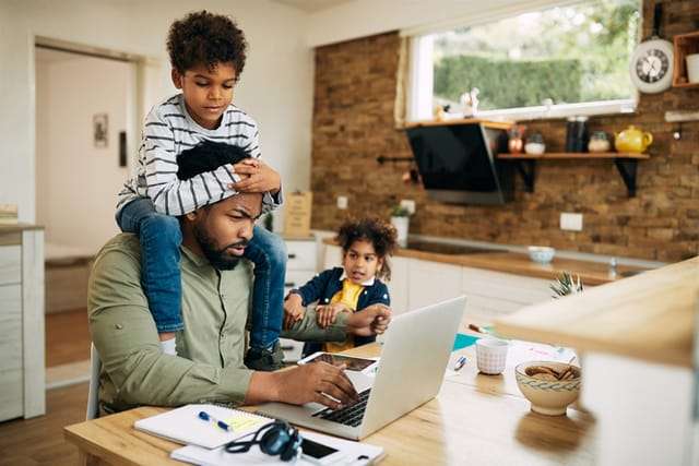 dad with kids at computer