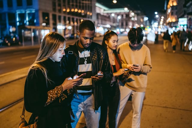 gen z texting on phones at night