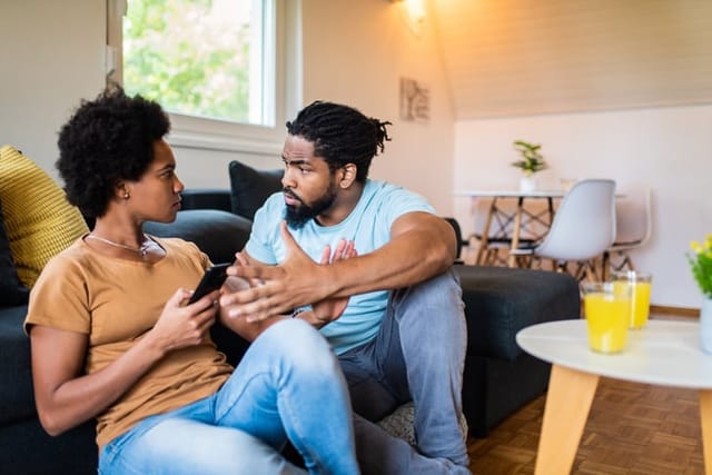 couple arguing in living room