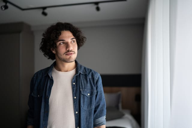 contemplative man at home