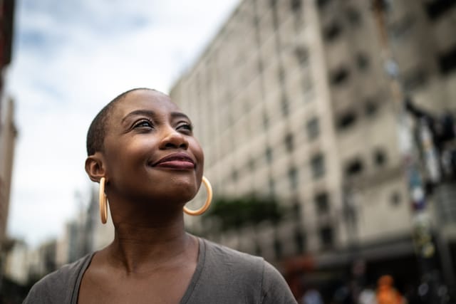 smiling woman looking to sky