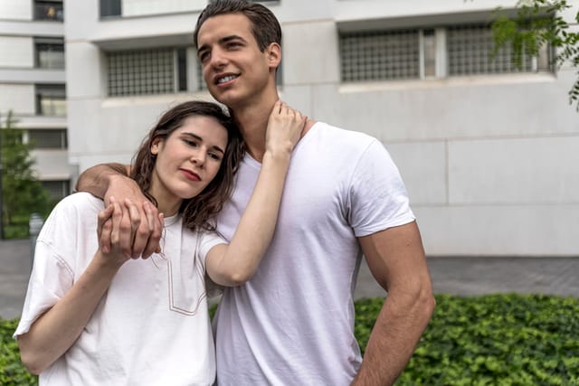 couple standing close in city center