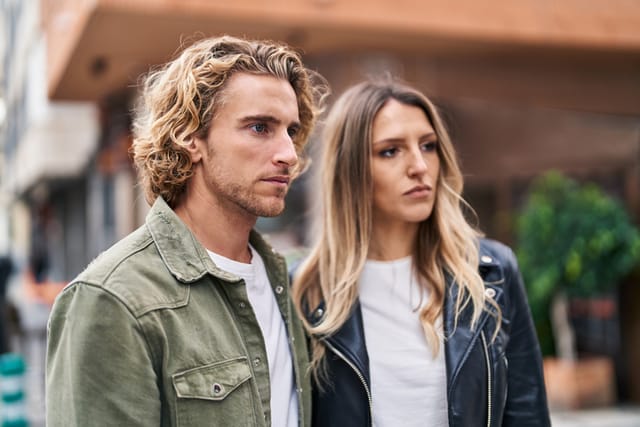 serious couple looking into distance