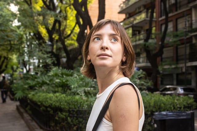 woman looking up into sky