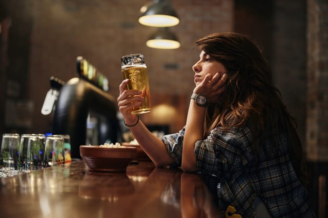 lonely woman at bar