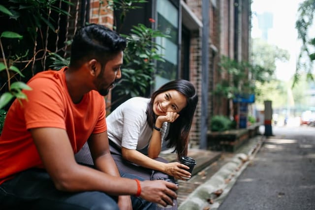 couple having flirty chat over coffee