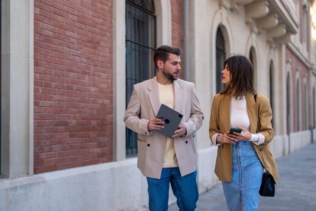 male and female colleagues walking