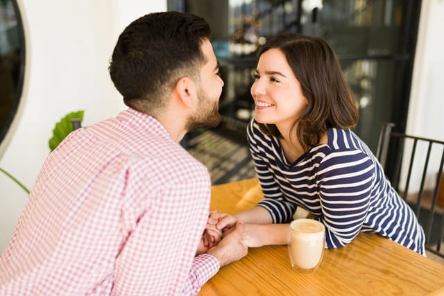 Gorgeous man and woman staring into each other's eyes