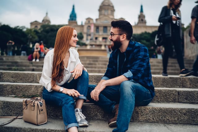 couple on date sitting on stairs