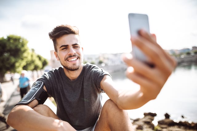 sport fitness man take a selfie in the city