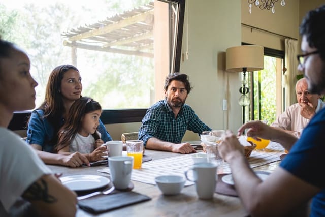 guy at dinner table with family