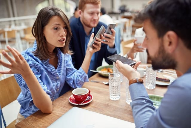 Businesswoman speaking with her colleagues.