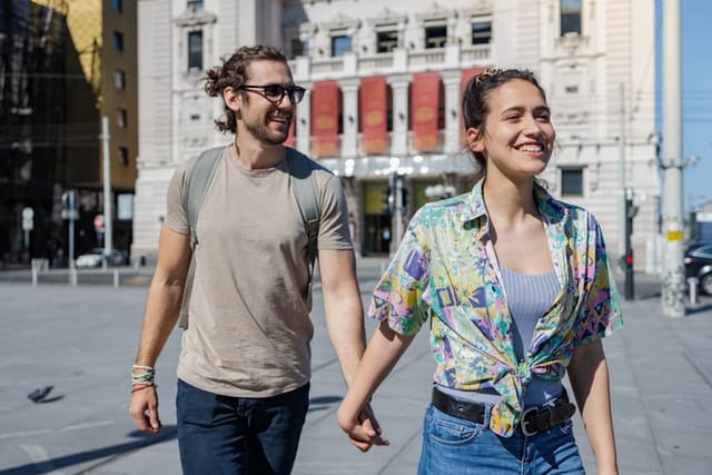 couple walking hand in hand on vacation