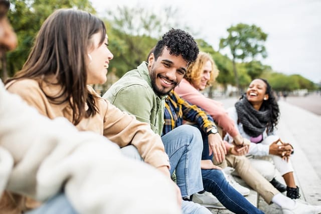 diverse group of friends laughing