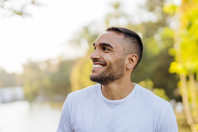 smiling man looking off to side