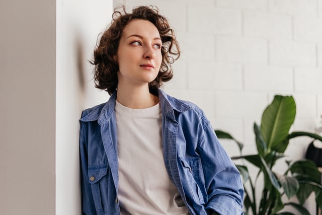 smiling woman looking off to side