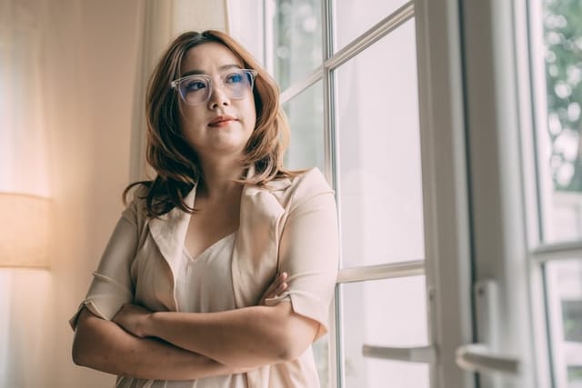 Portrait of pensive mature businesswoman looking away, planning start up.