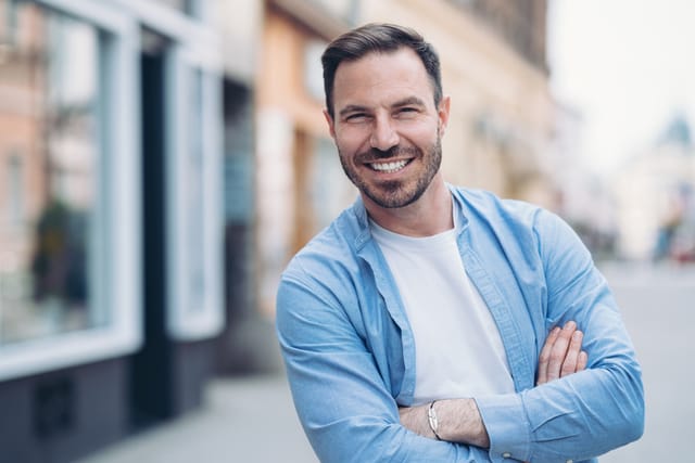 Portrait of a smiling man standing outdoors