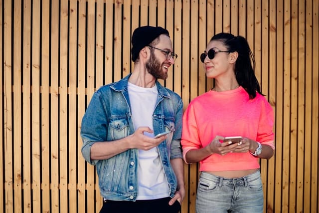 couple standing face to face outside