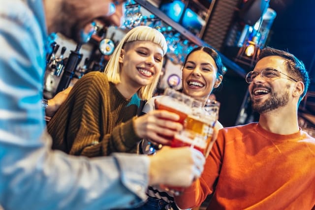 friends drinking together at the bar