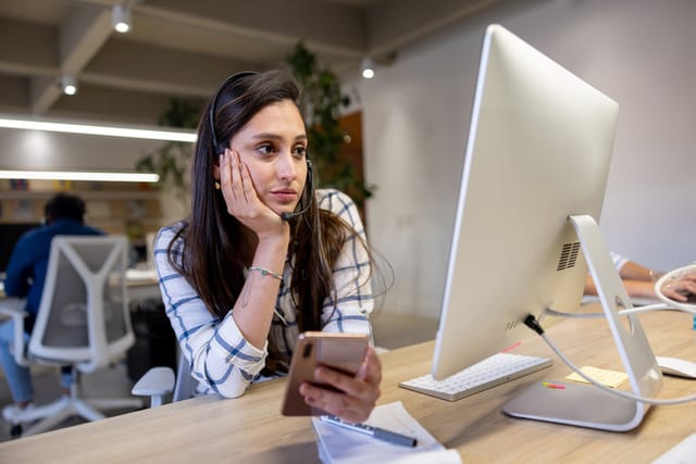 concentrating woman looking at computer