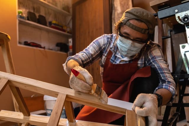 guy painting wood