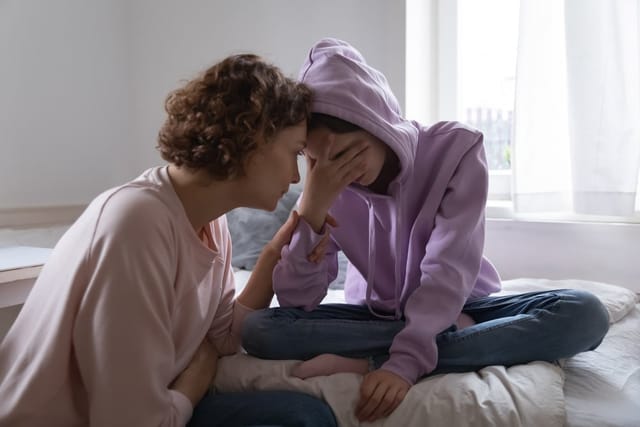 Mother and daughter having a talk.