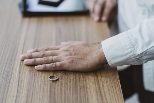 Man removed his wedding band.