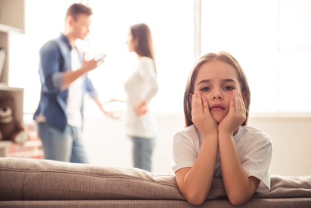 Little girl looks sad.
