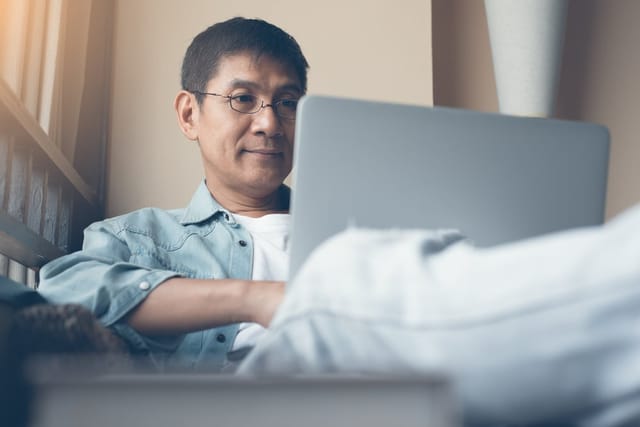 Man sitting at his computer.