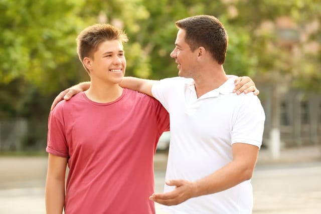 Teen with is father.