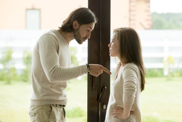 Unhappy young couple arguing.