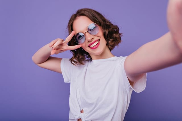 Young girl taking a selfie.