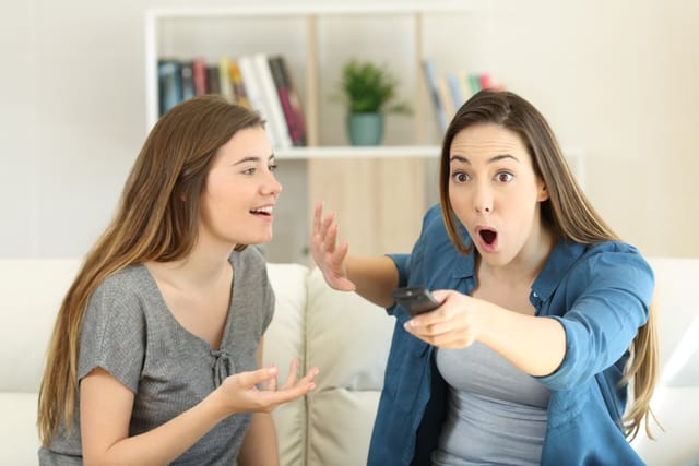 One woman interrupting another.