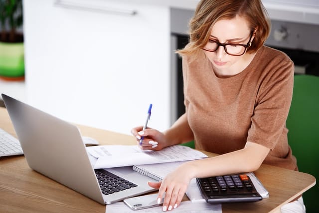 Woman working on her computer.