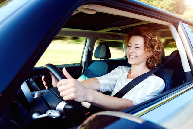 Woman driving her car.