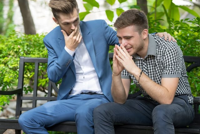 Two men in a heated discussion.