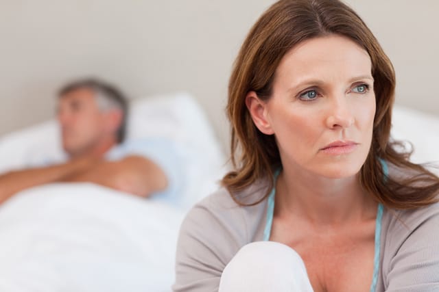 Man and wife in bed.