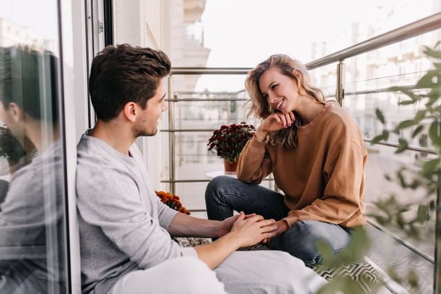 Friends having a chat at home.
