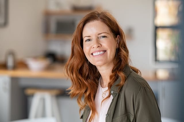 A smiling mature redhead woman