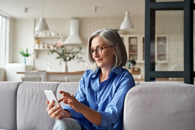 Woman with short gray hair.