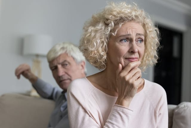 Close up of unhappy distressed older woman.