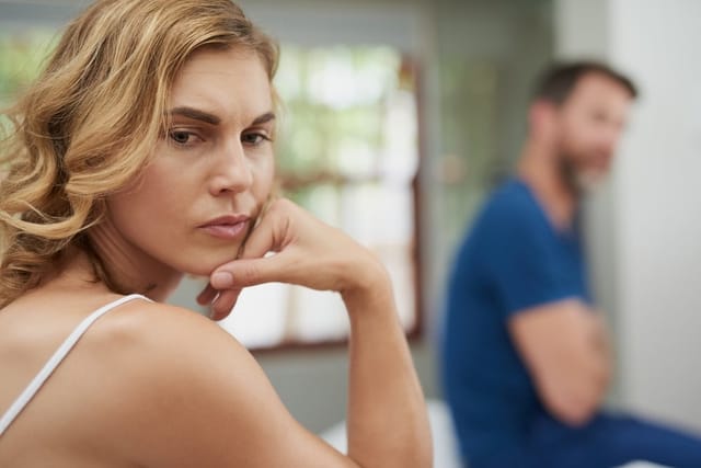 Young couple refusing to speak.