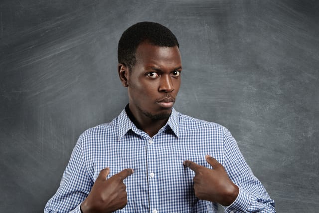 Man pointing at himself.