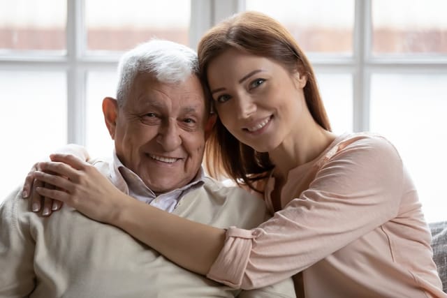Grandfather with his granddaughter at home.