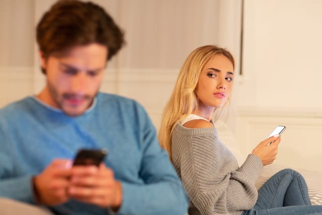 Woman and her boyfriend not speaking to one another.